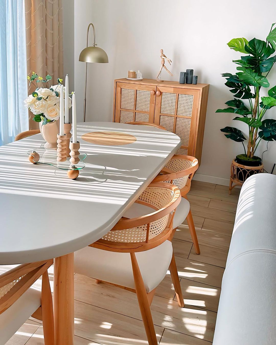 A neatly organized dining space featuring modern Scandinavian style