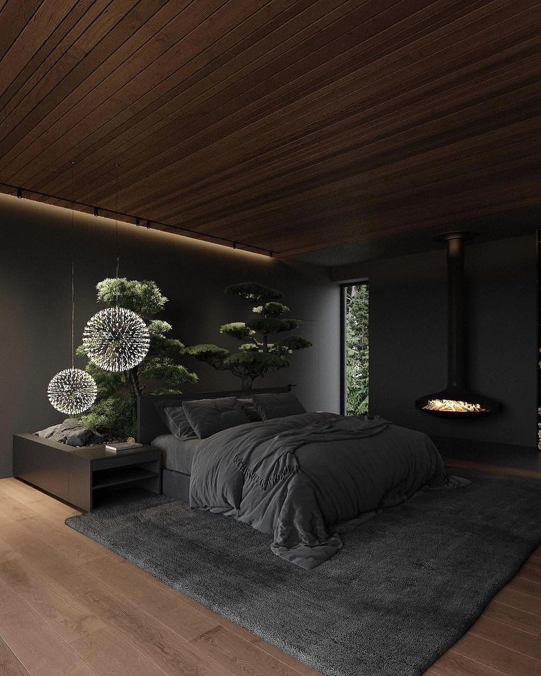 A serene bedroom featuring a bonsai tree and a modern fireplace