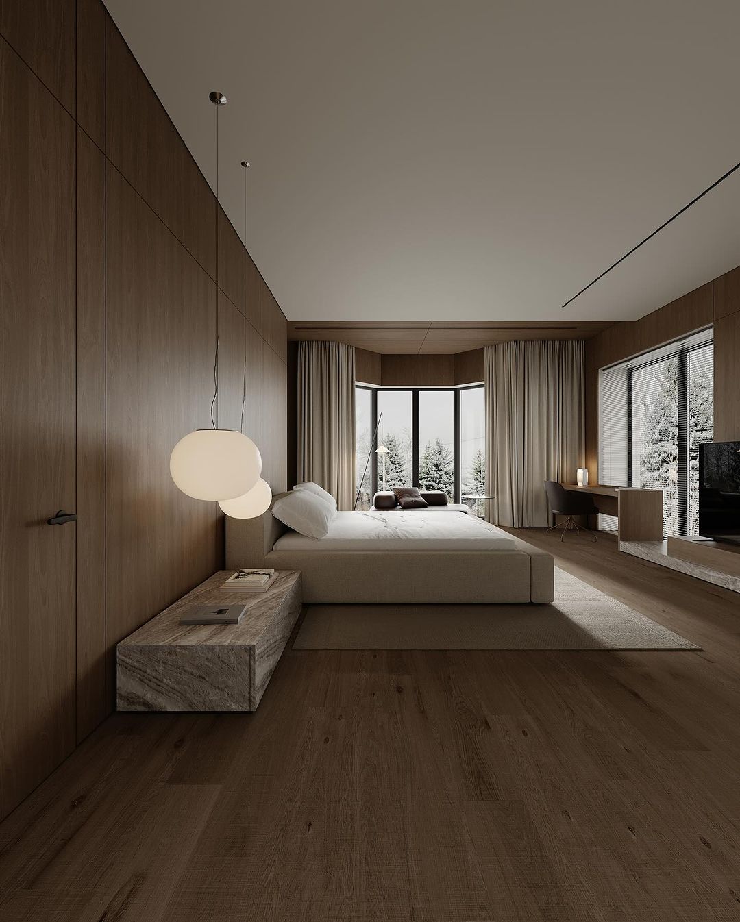 A serene bedroom with panoramic forest views