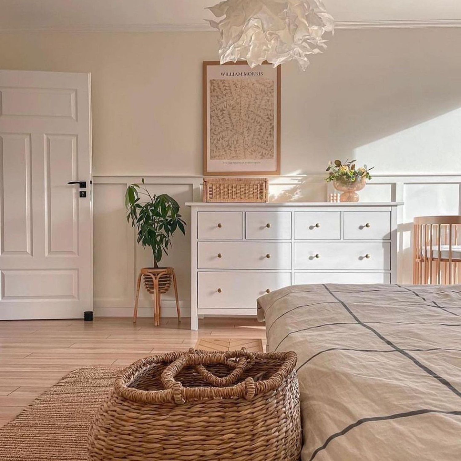 A serene and tastefully furnished bedroom featuring natural textures and soft hues