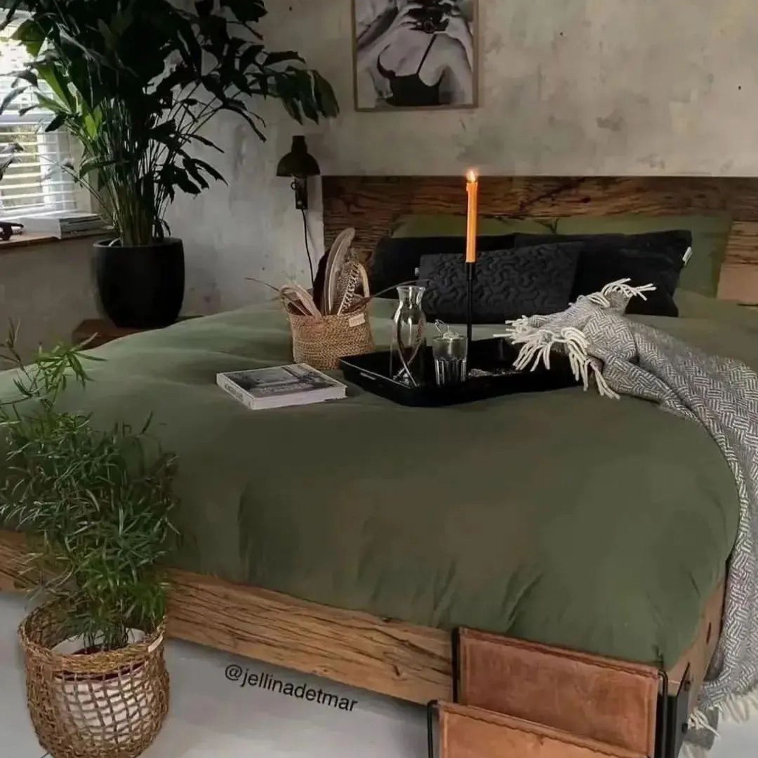 A serene bedroom setup featuring a rustic theme with a lush green bedspread