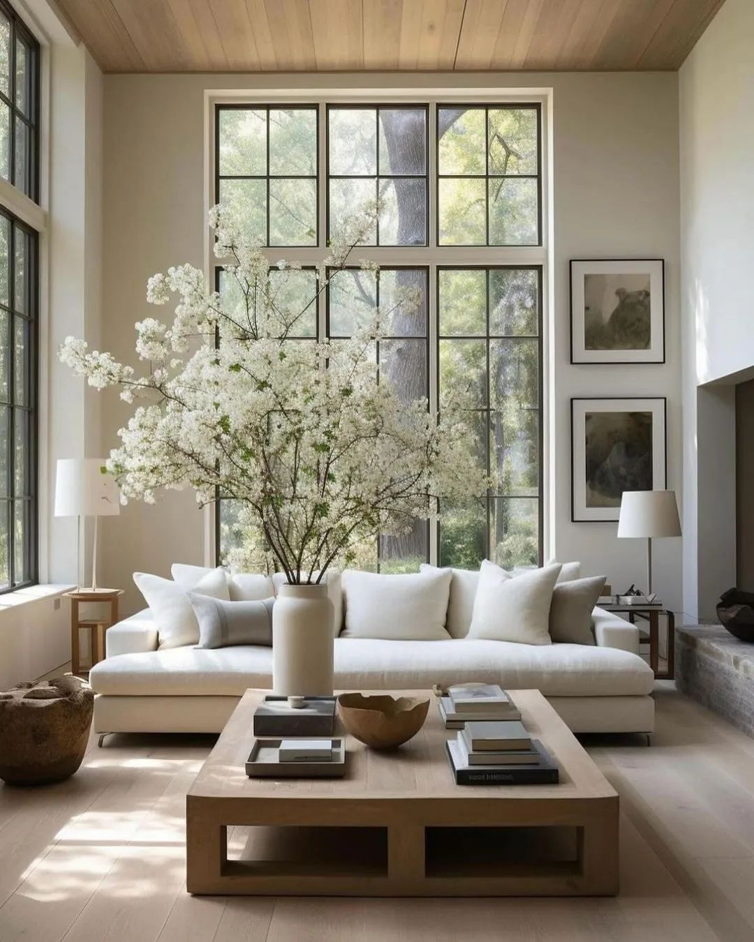 A serene living room with large windows and natural light