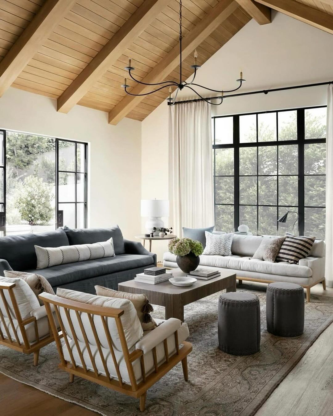 A serene living room with high ceilings and large windows