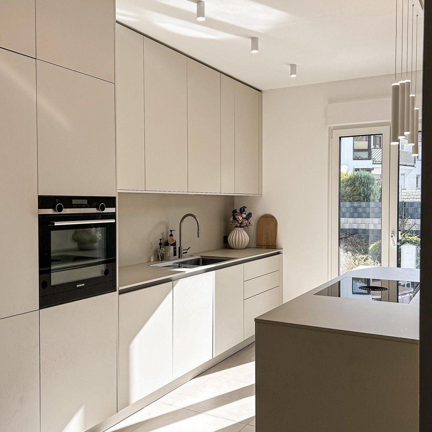 Modern minimalist kitchen with ample sunlight