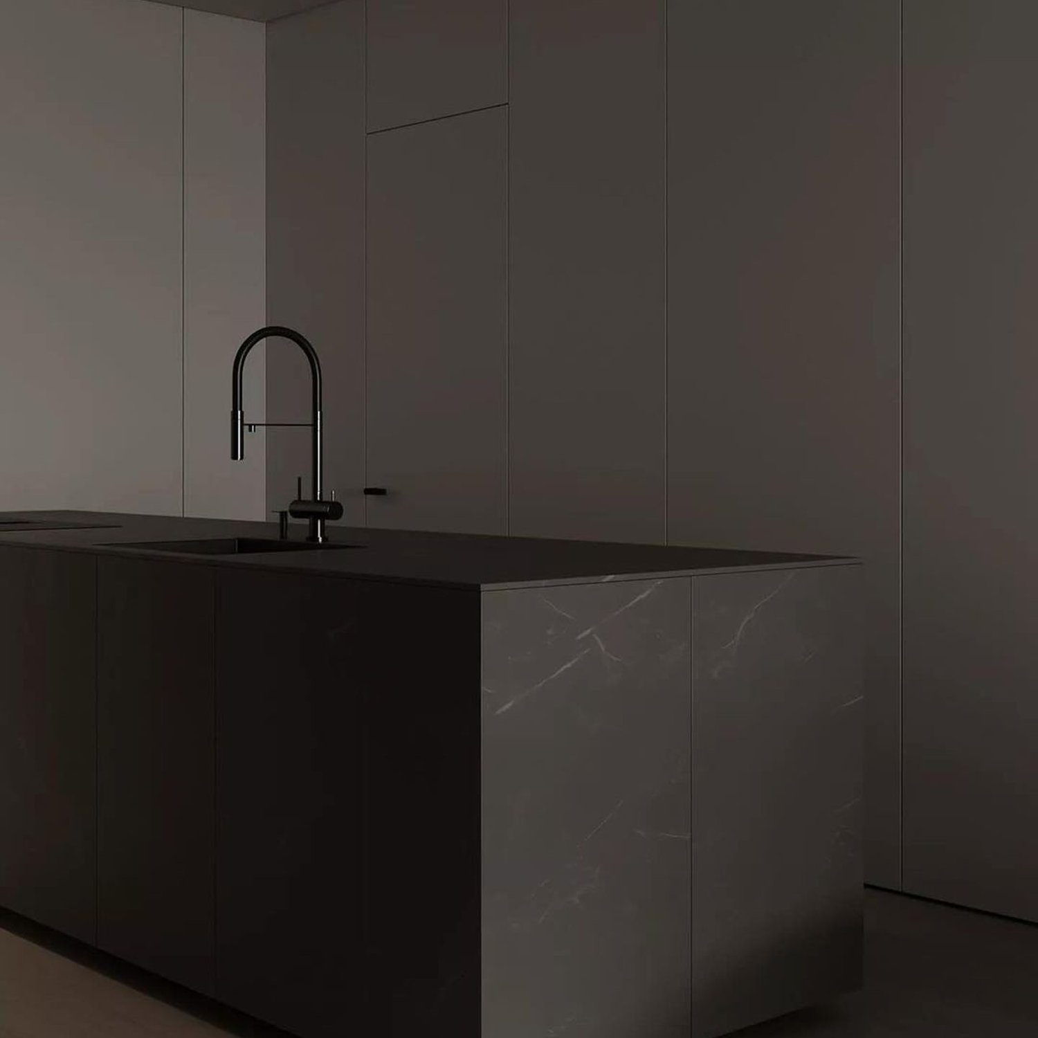 Sleek and modern dark kitchen island with integrated marble sink