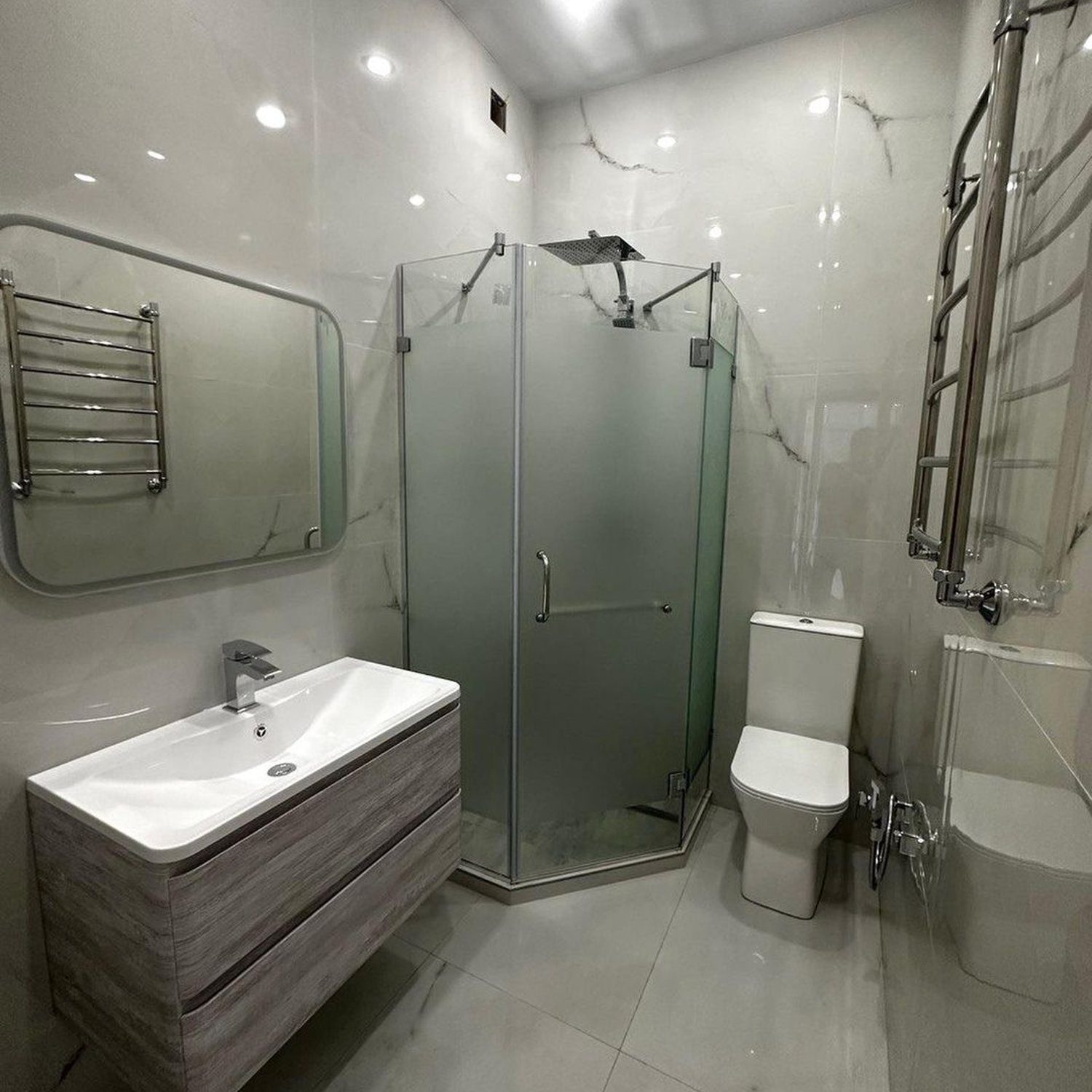 A sleek and modern bathroom featuring marble-like tiles