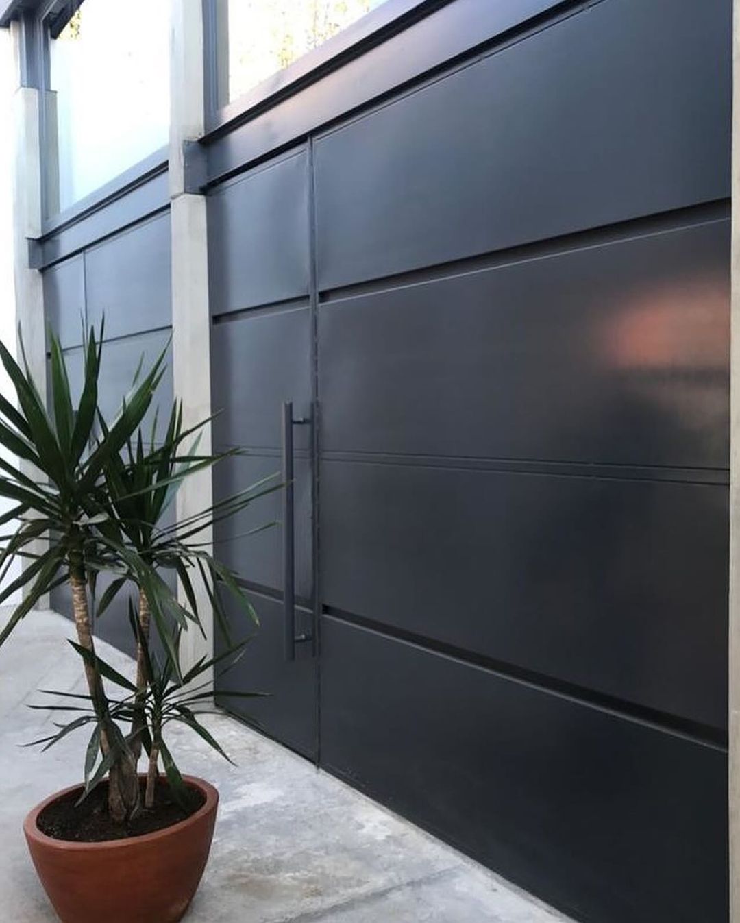 A modern and sleek dark metallic gate