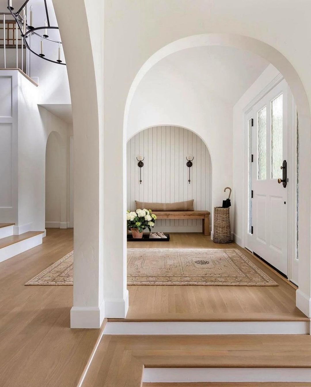 A spacious and welcoming entryway featuring an arched design.