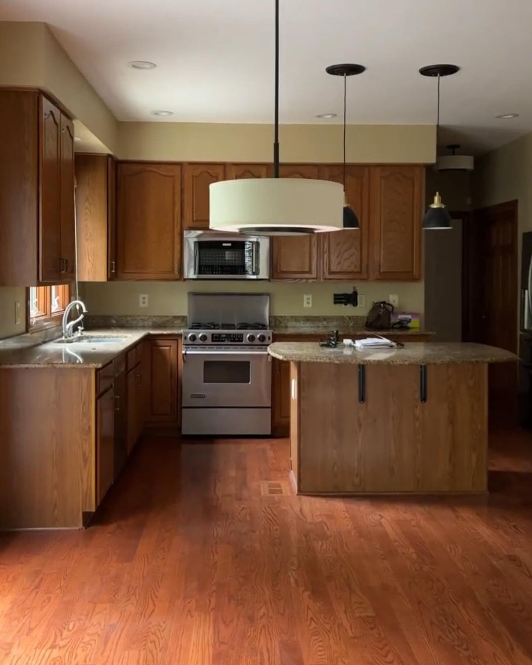 A well-lit kitchen with wood cabinetry and modern appliances.