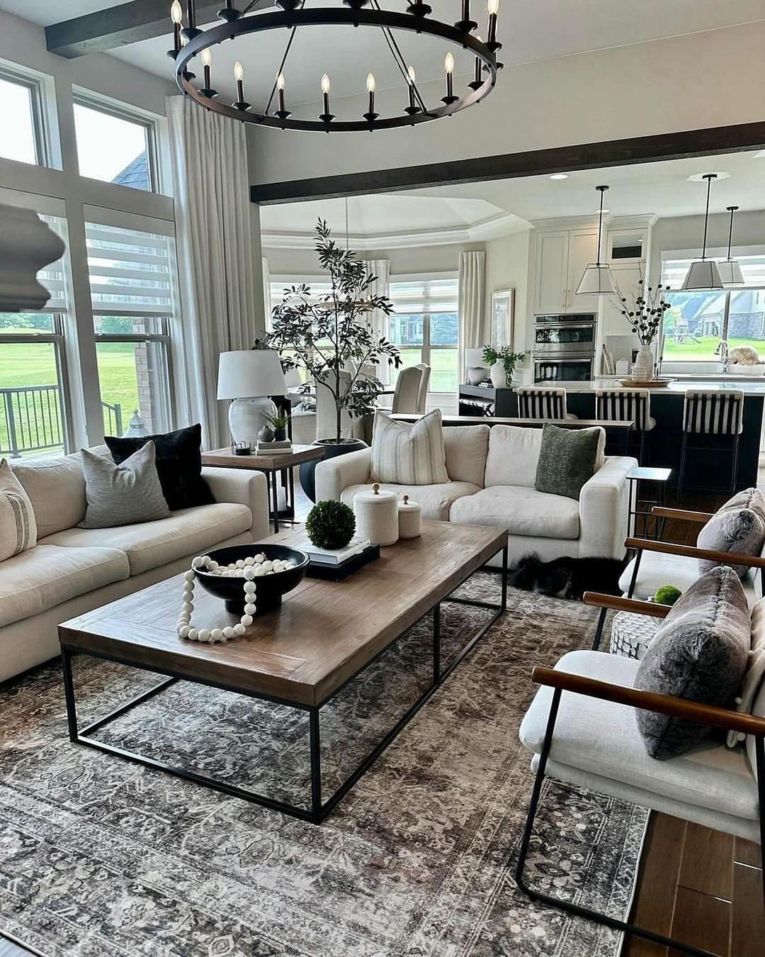 A spacious and modern living room featuring natural light