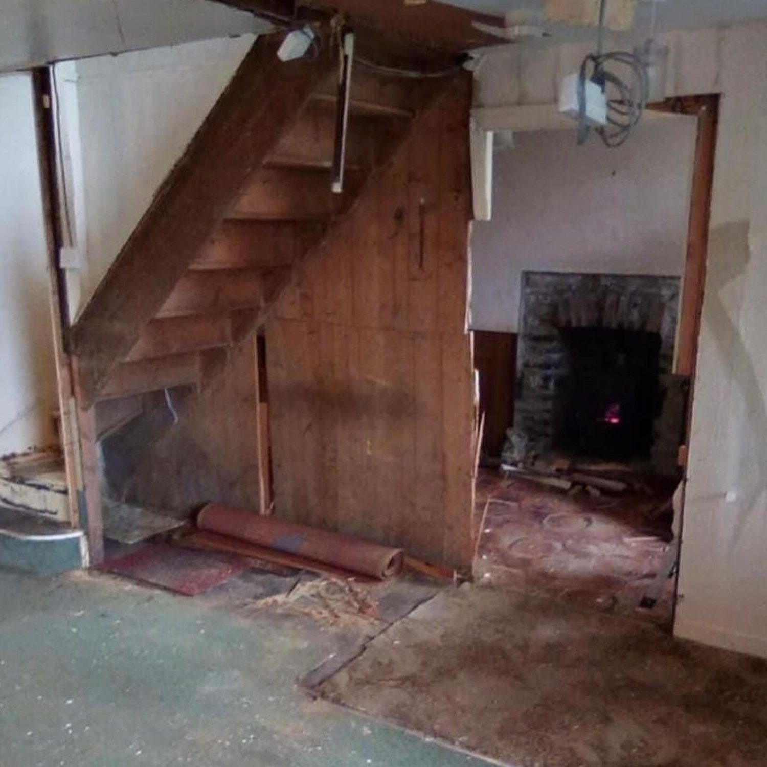 An unconventional staircase design in a dilapidated room