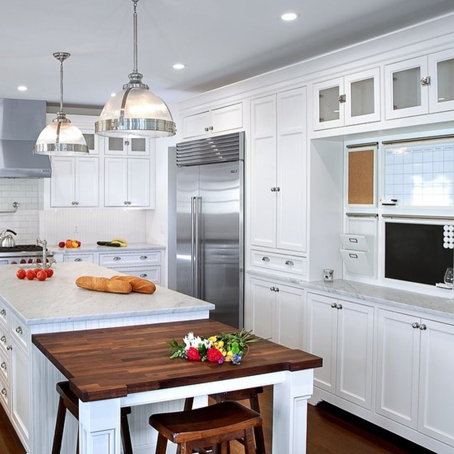 Elegant white kitchen with wooden accents