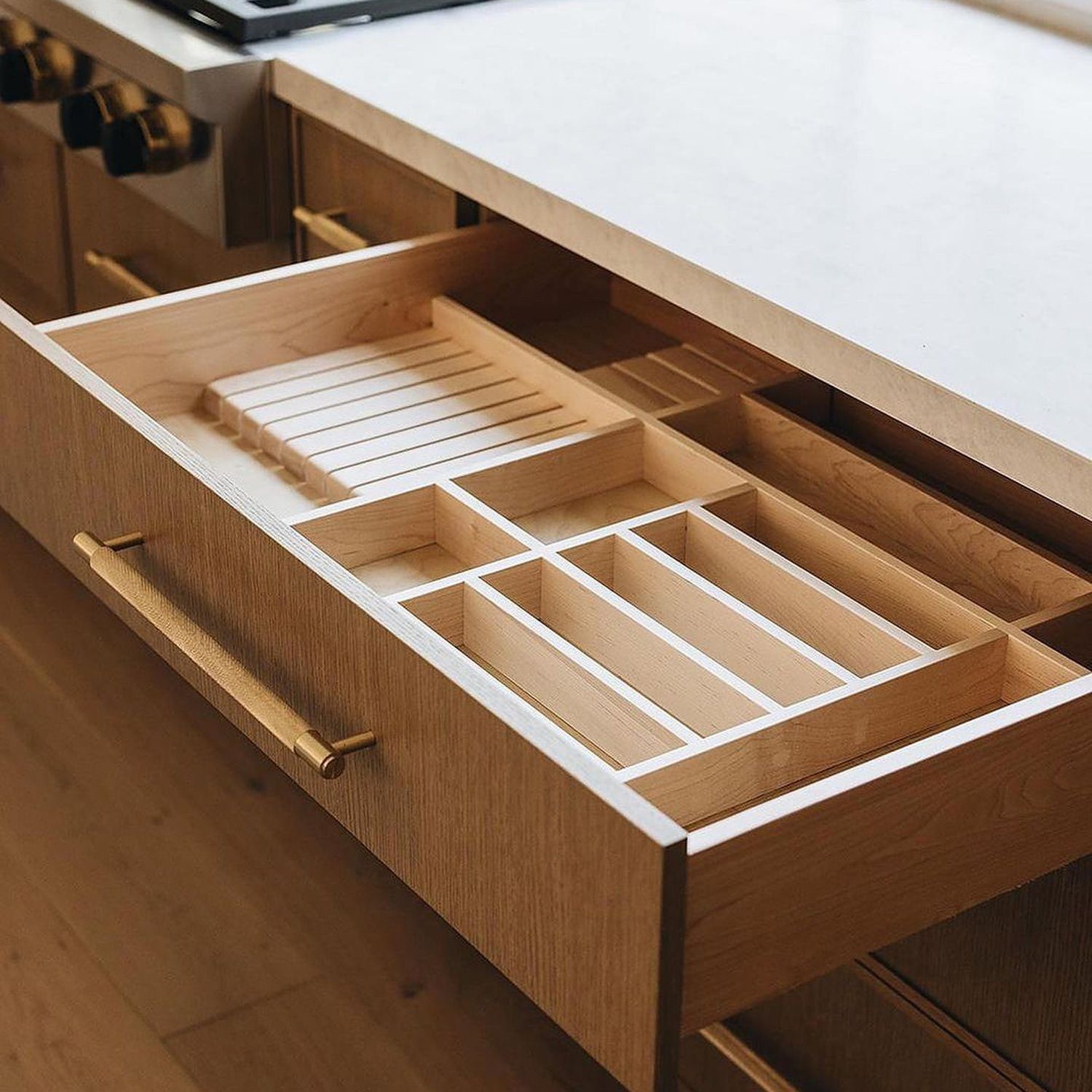 A modern kitchen drawer with built-in organizers