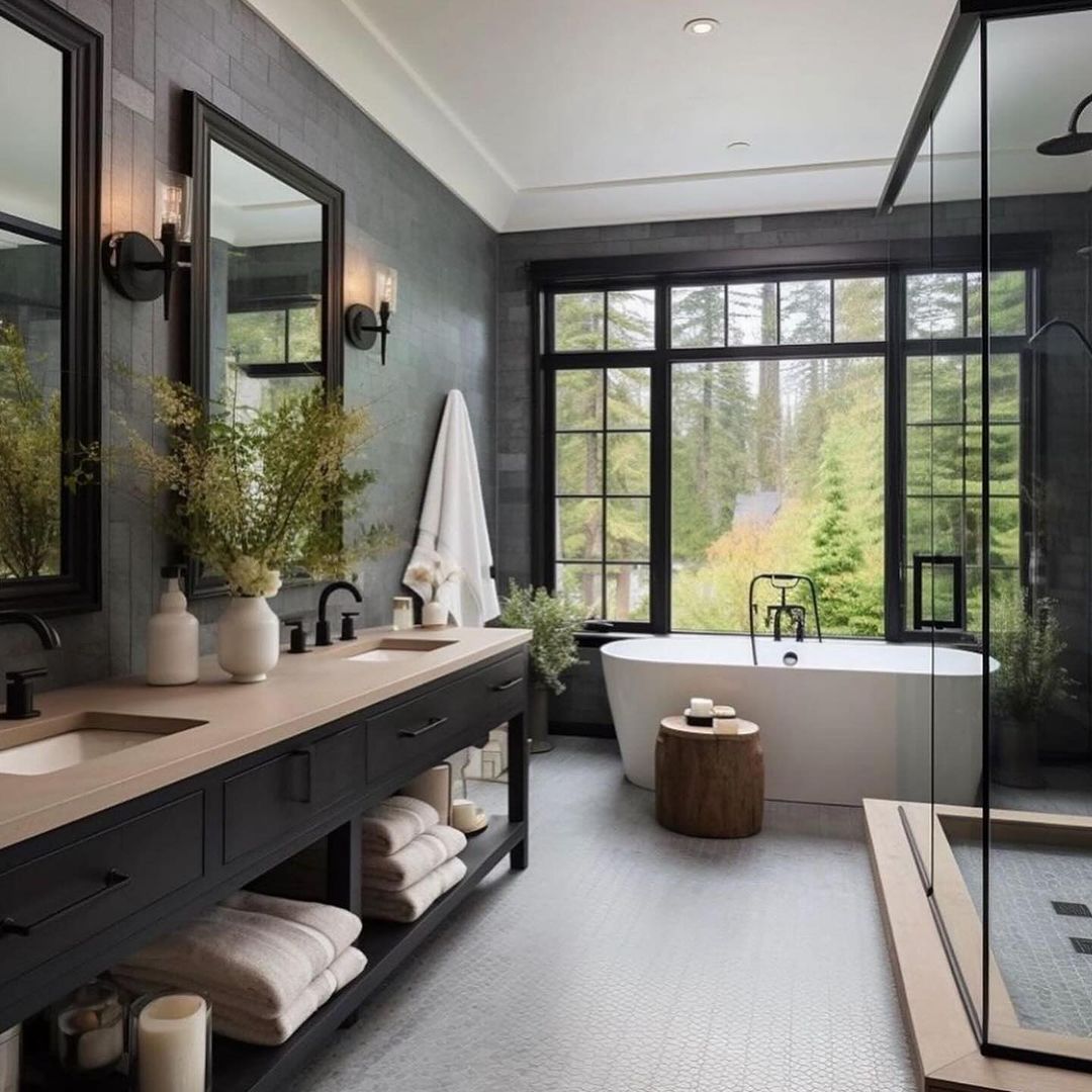 A modern bathroom with floor-to-ceiling windows and a forest view