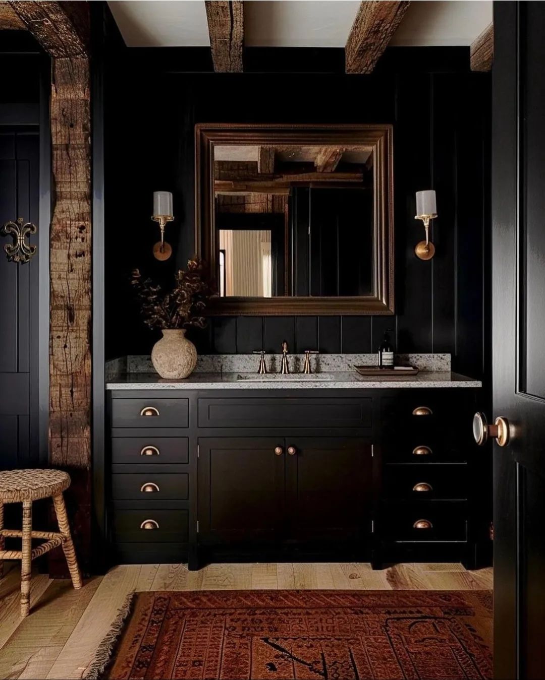 Stylish bathroom with a dark theme, boasting a wooden beamed ceiling