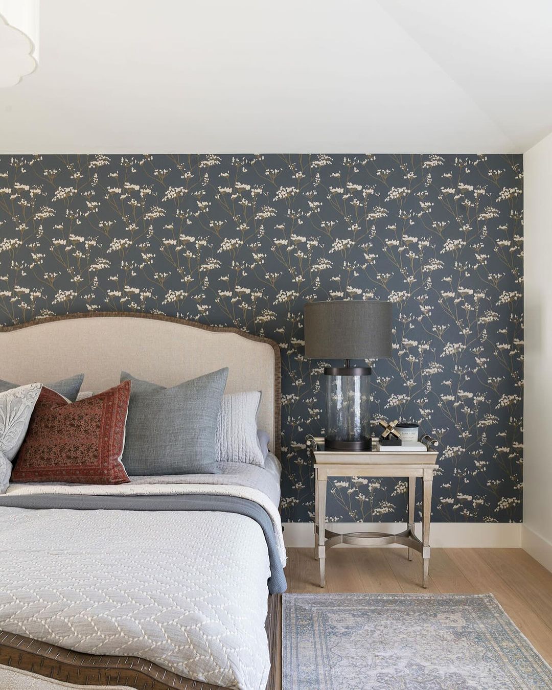 A chic and stylish bedroom with botanical wallpaper