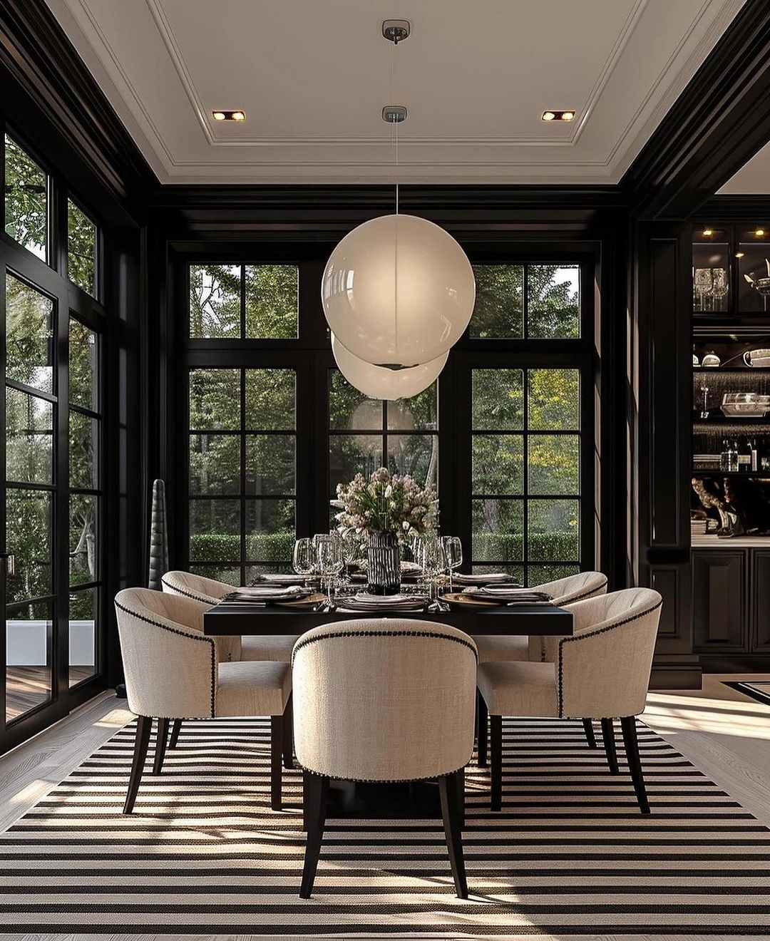 A sophisticated dining room featuring a large globe pendant light