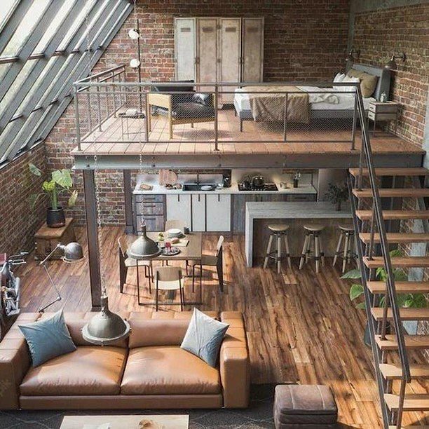 A stylish industrial loft featuring exposed brick walls and a mezzanine level