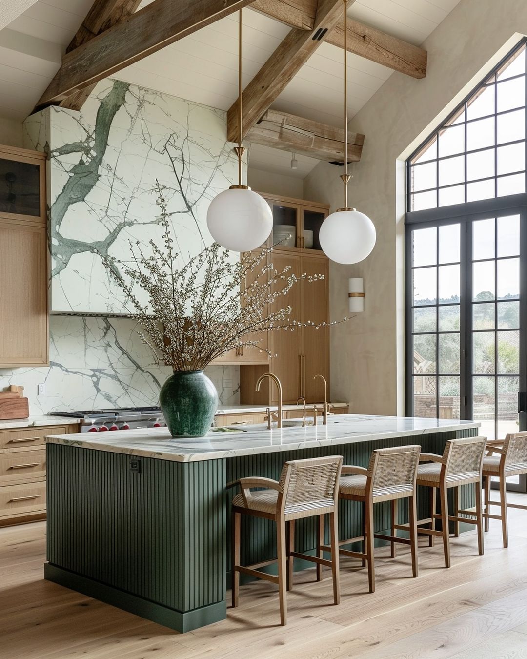 A modern kitchen with exposed wooden beams and a large central island.