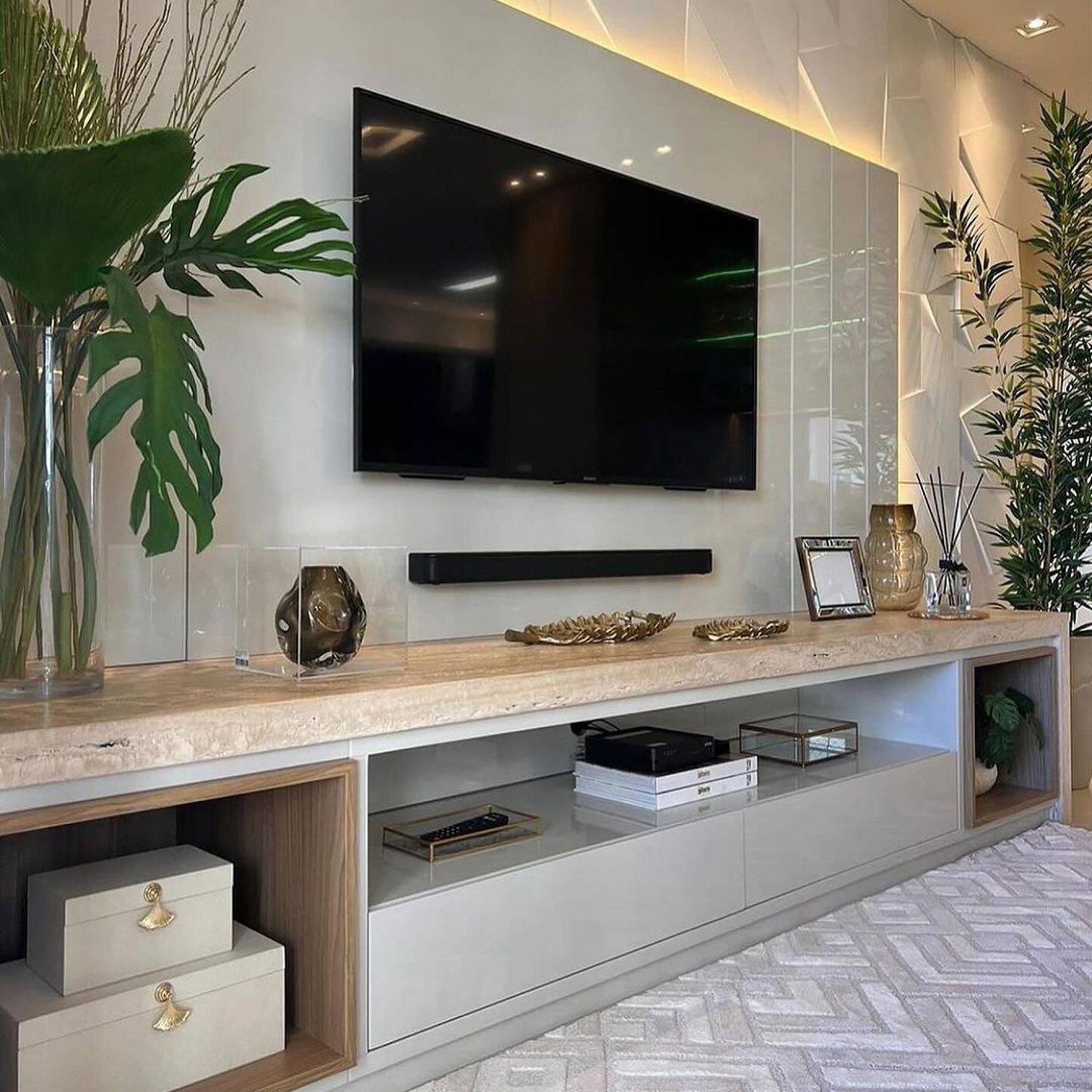 Elegant and modern living room with textured wall and sleek entertainment center