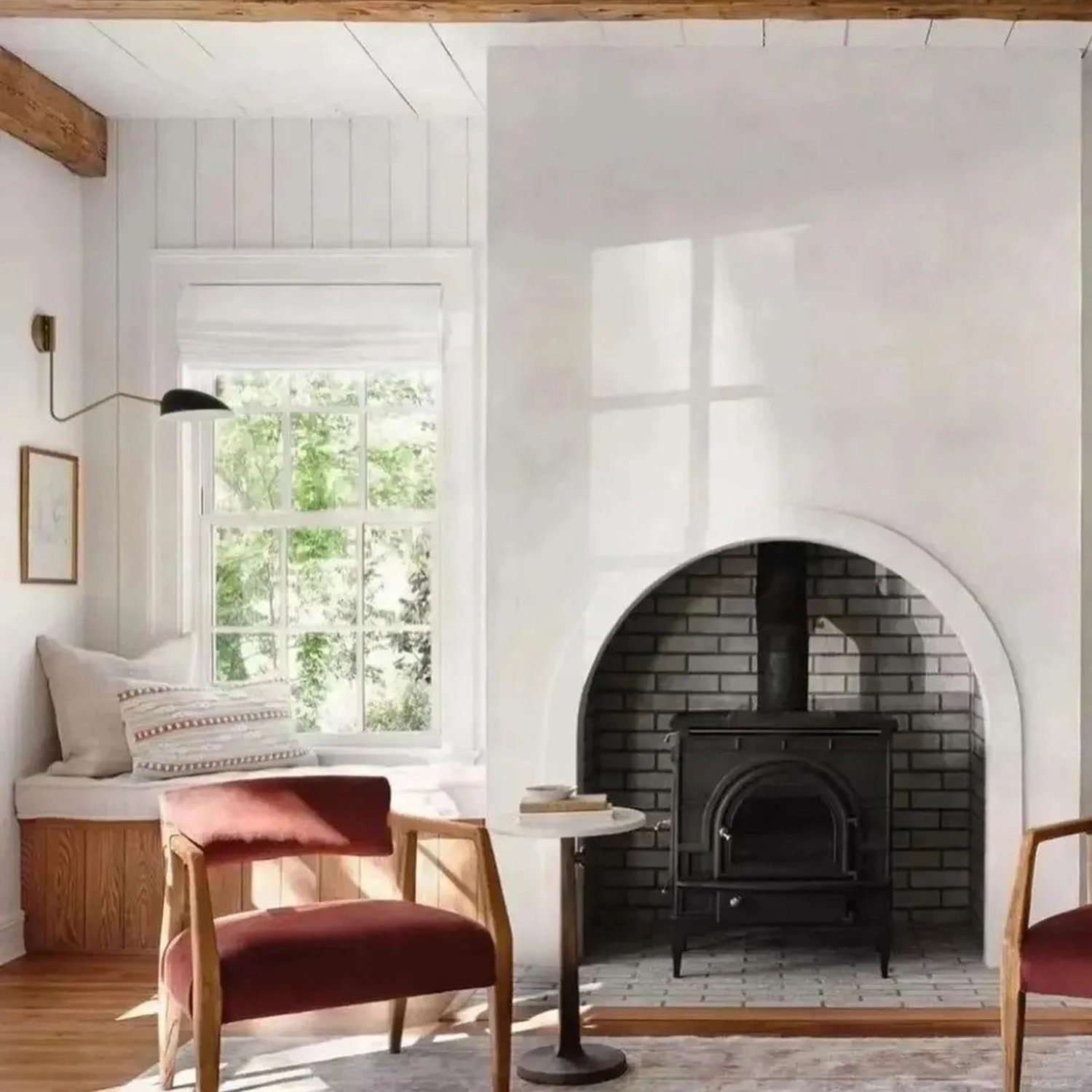 A cozy and stylish living room featuring a traditional fireplace