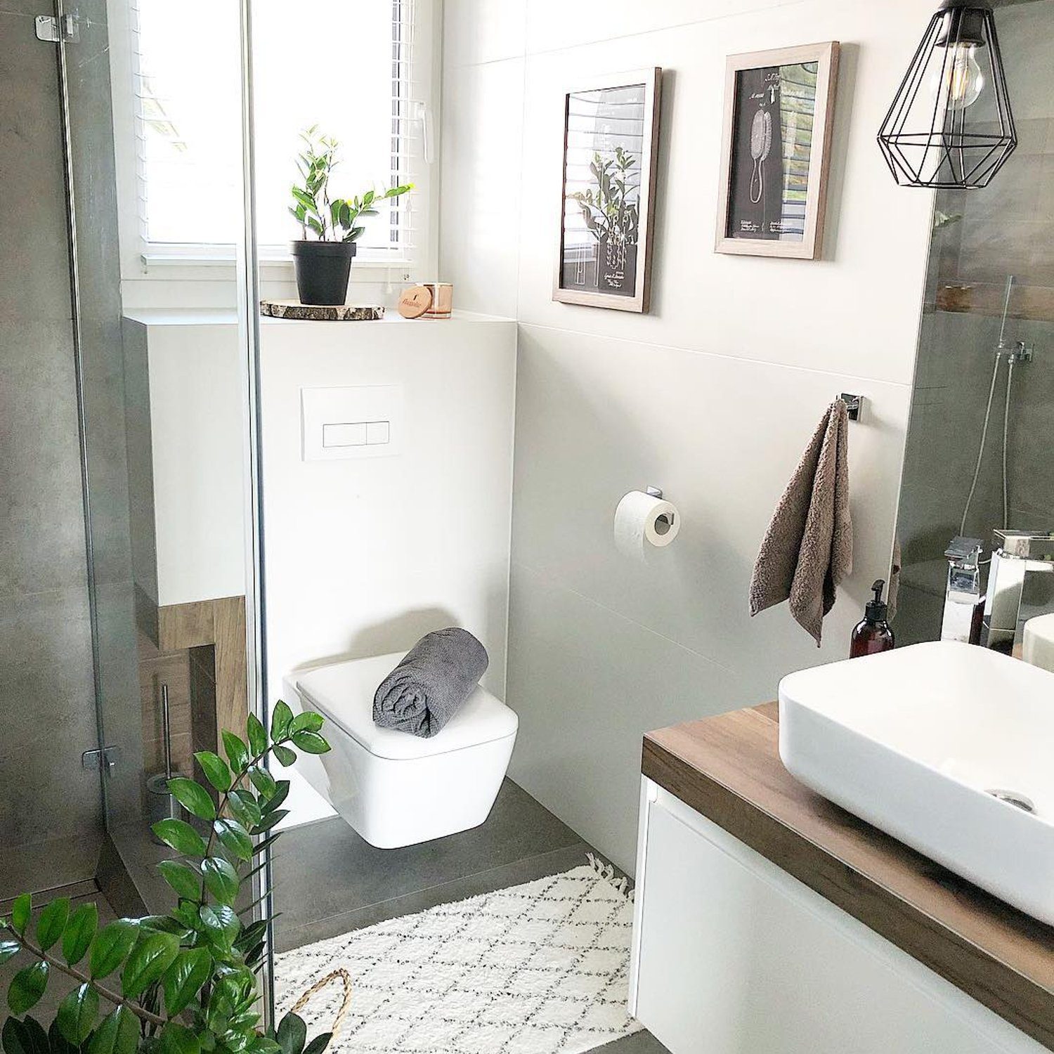 A stylish and modern bathroom featuring sleek fixtures and natural elements