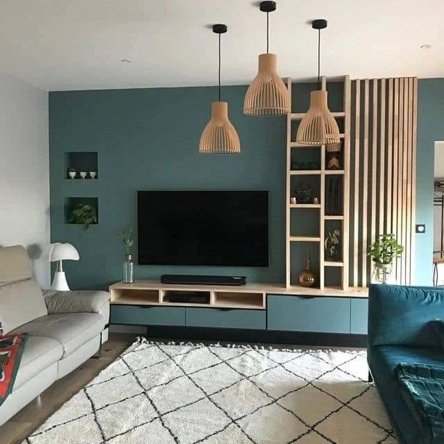 Stylish modern living room with teal accent wall