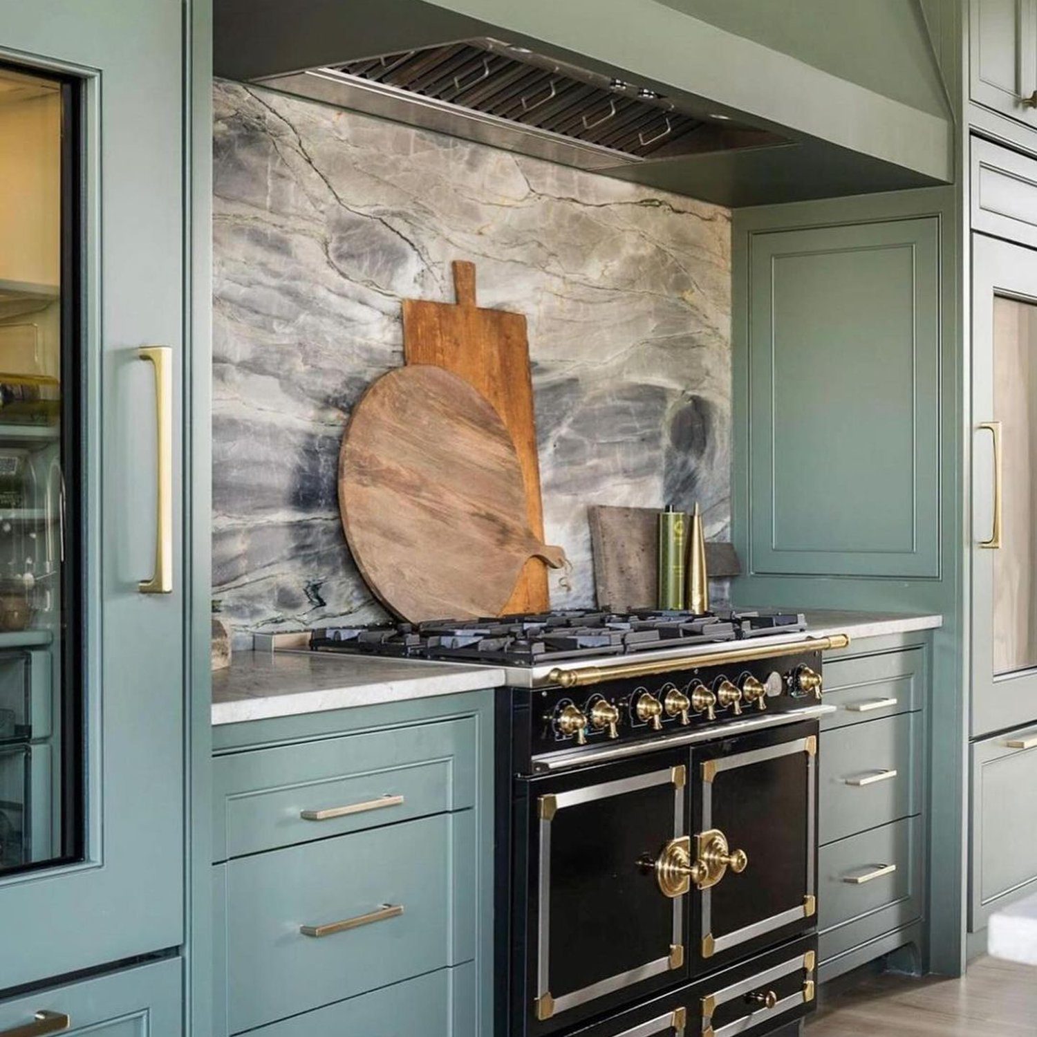 Elegant kitchen design featuring two-toned cabinetry and luxe appliances