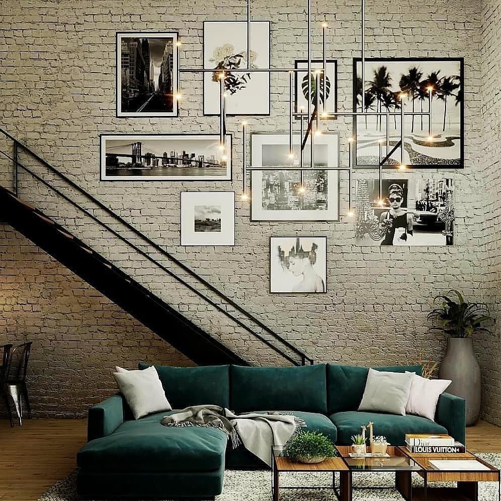 Stylish urban living room with exposed brick walls and a teal sectional sofa