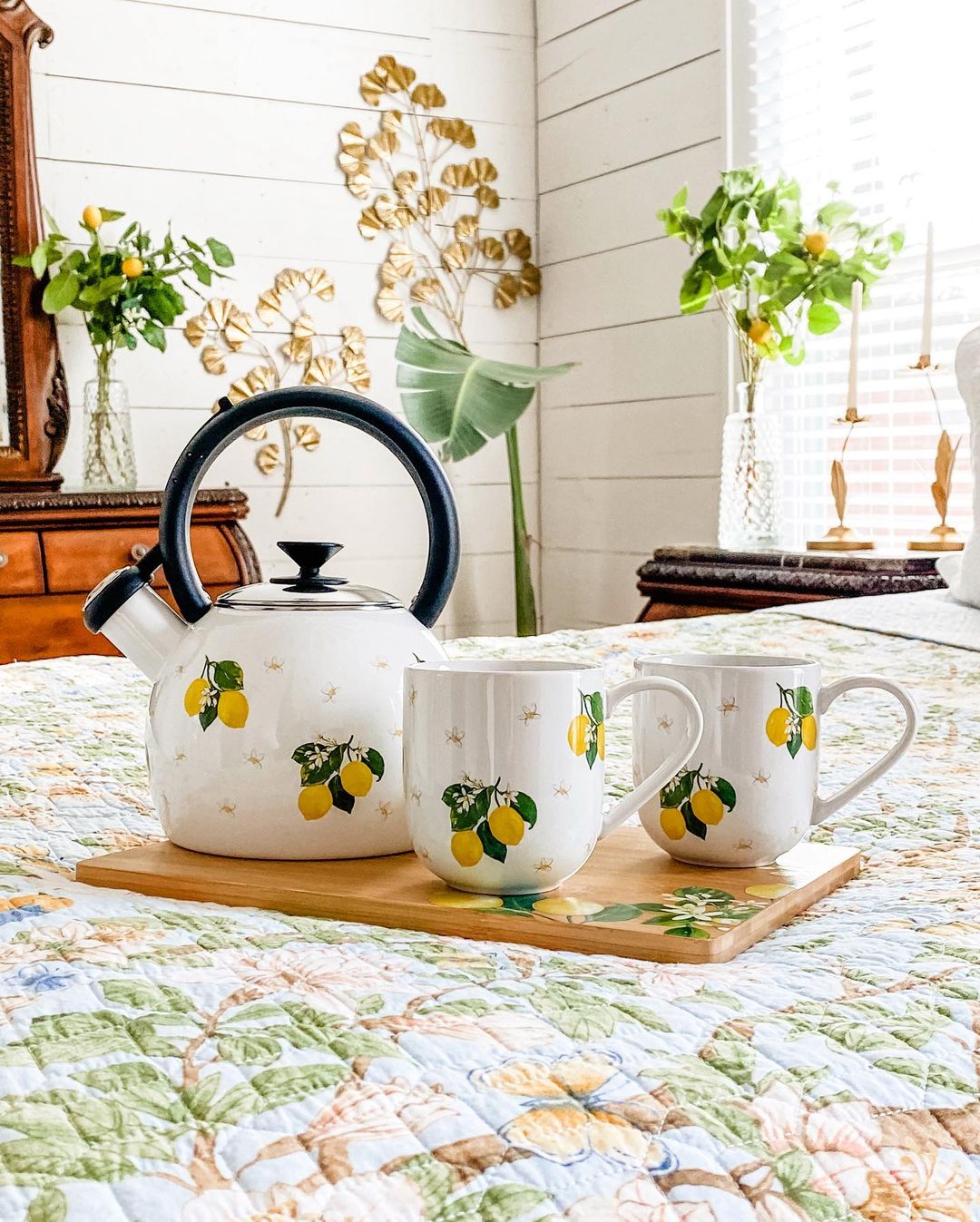 A charming tea set with a lemon design on a wooden tray