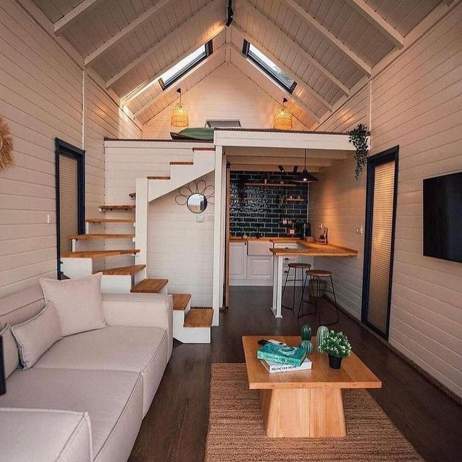 A chic tiny home interior with vaulted ceilings