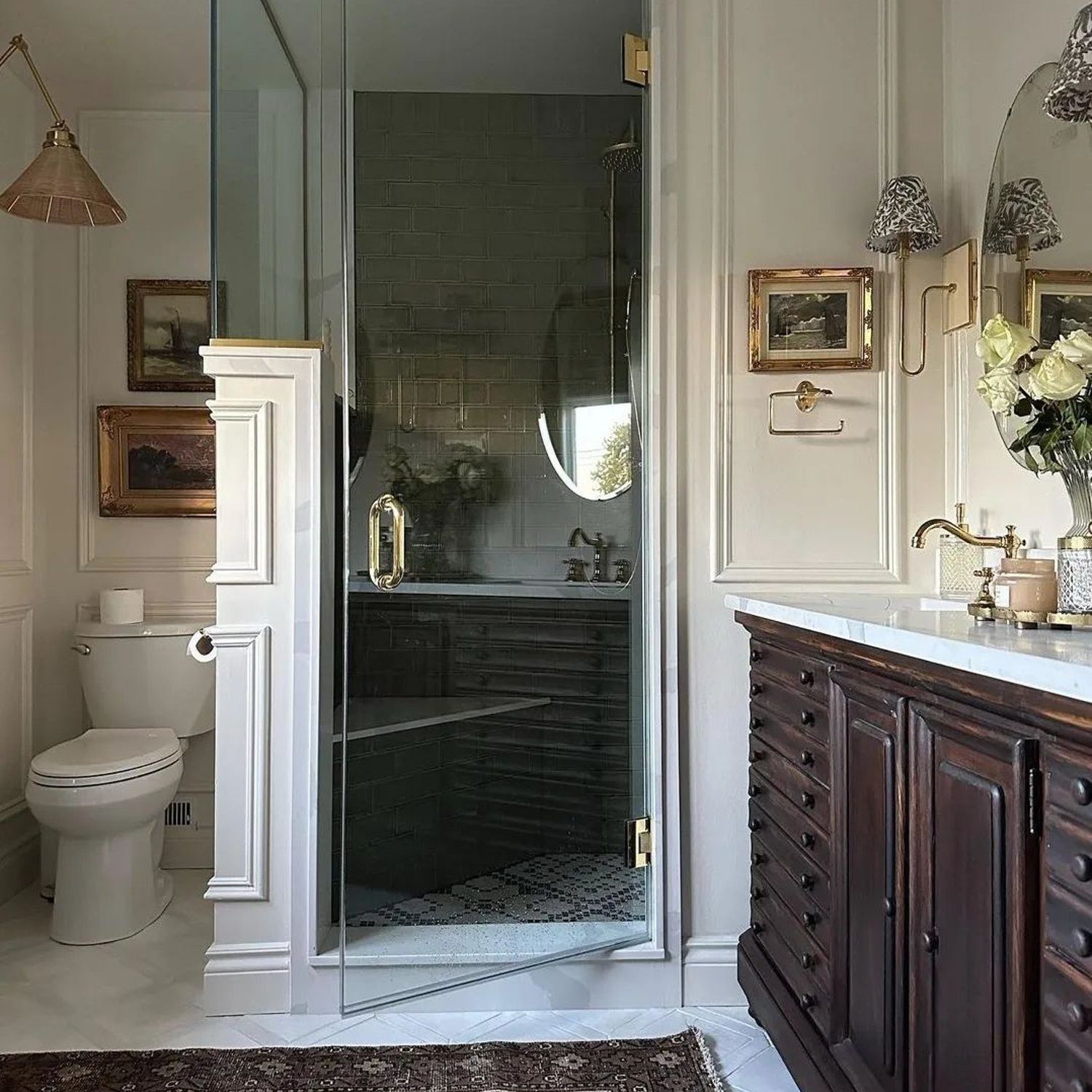 Elegant traditional bathroom featuring a wood and metal vanity