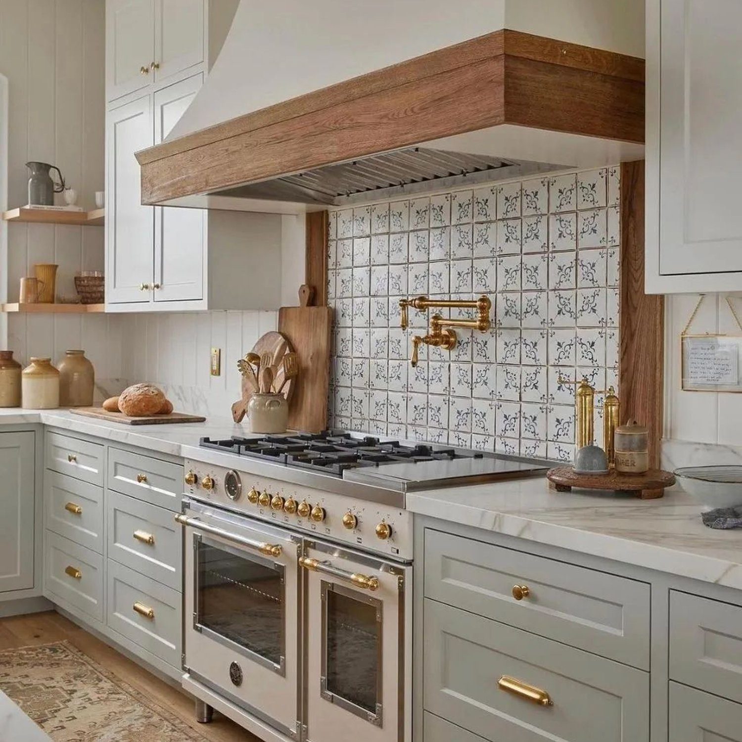 Elegant kitchen with detailed tile backsplash and gold accents