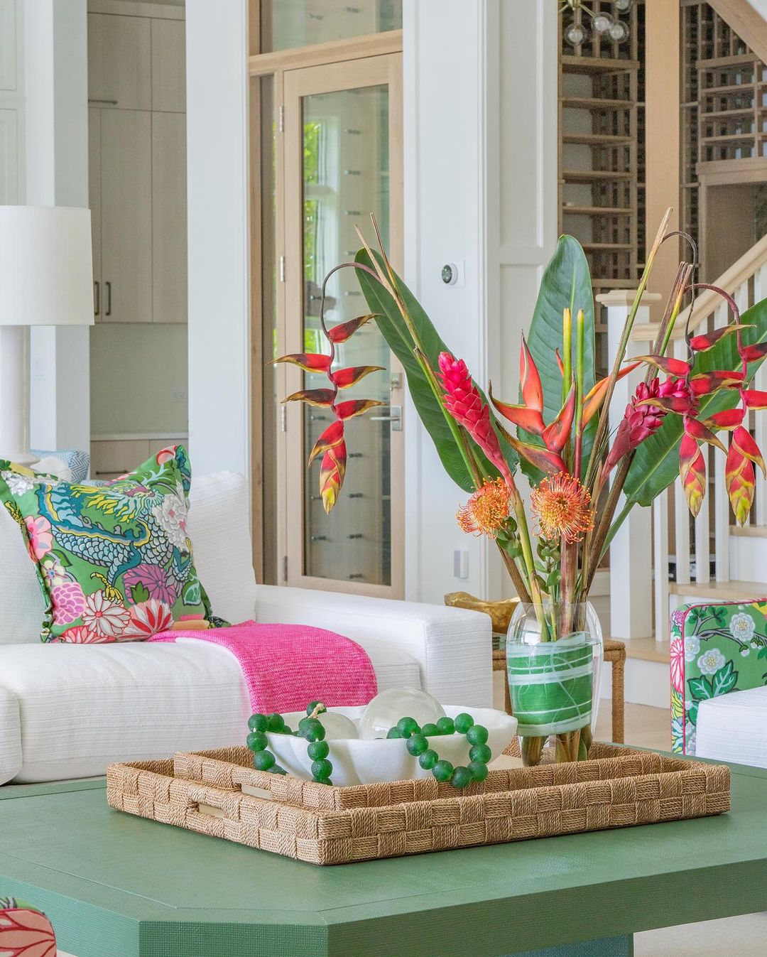 Tropical-themed living room with vibrant floral accents