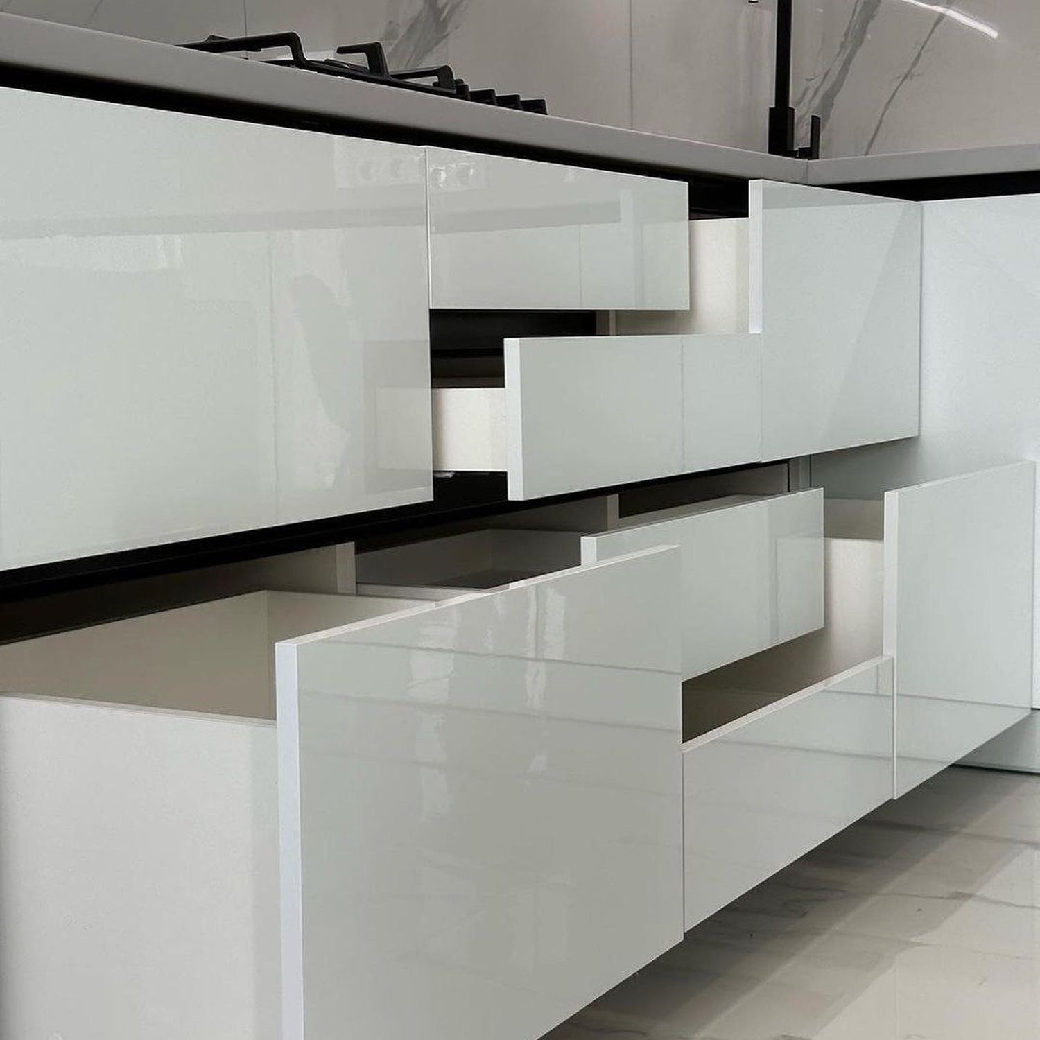 Ultra-modern kitchen with seamless white cabinetry