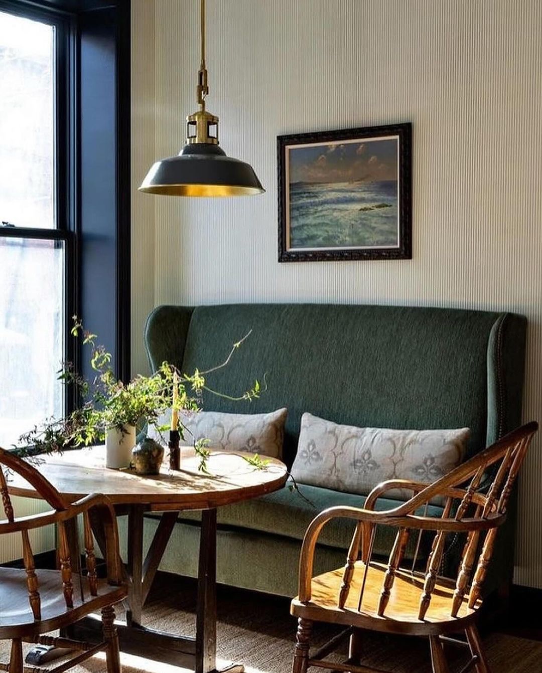 Cozy green sofa and wooden furniture in a vintage styled room