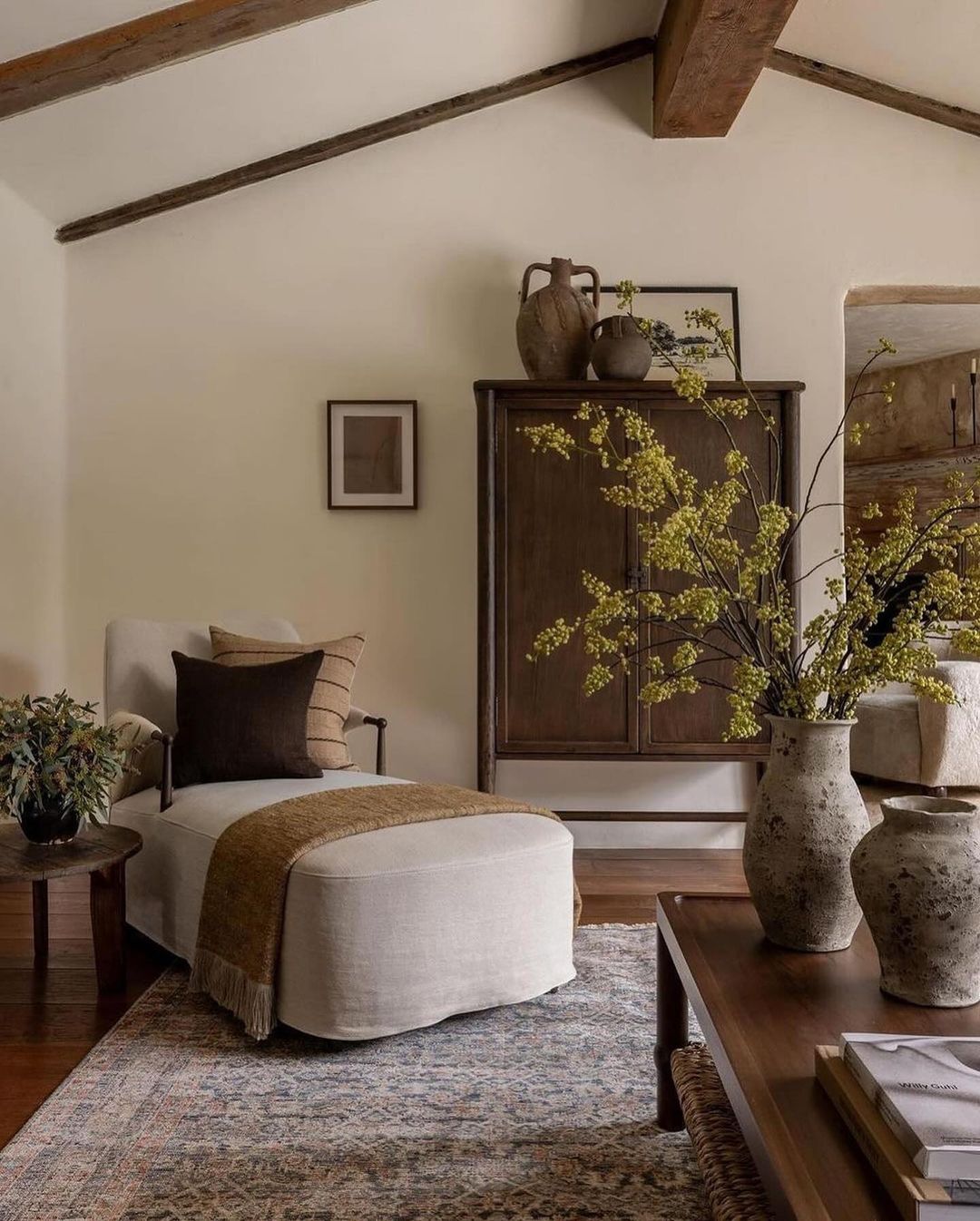 Cozy corner in a rustic living room featuring exposed wooden beams