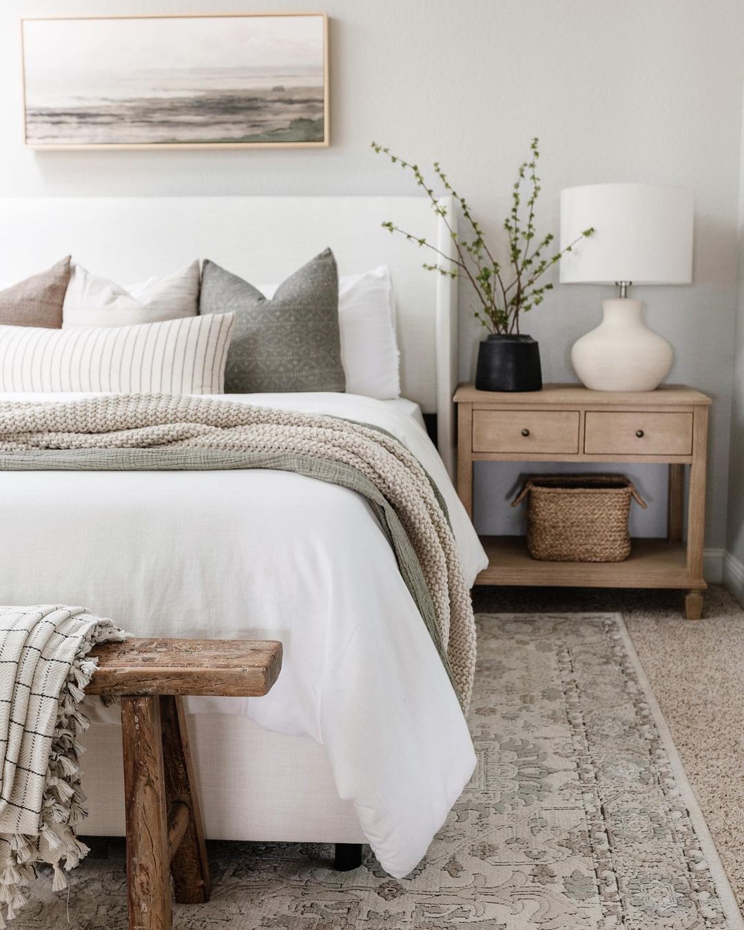 Cozy and well-appointed bedroom with a serene color palette and textured accents