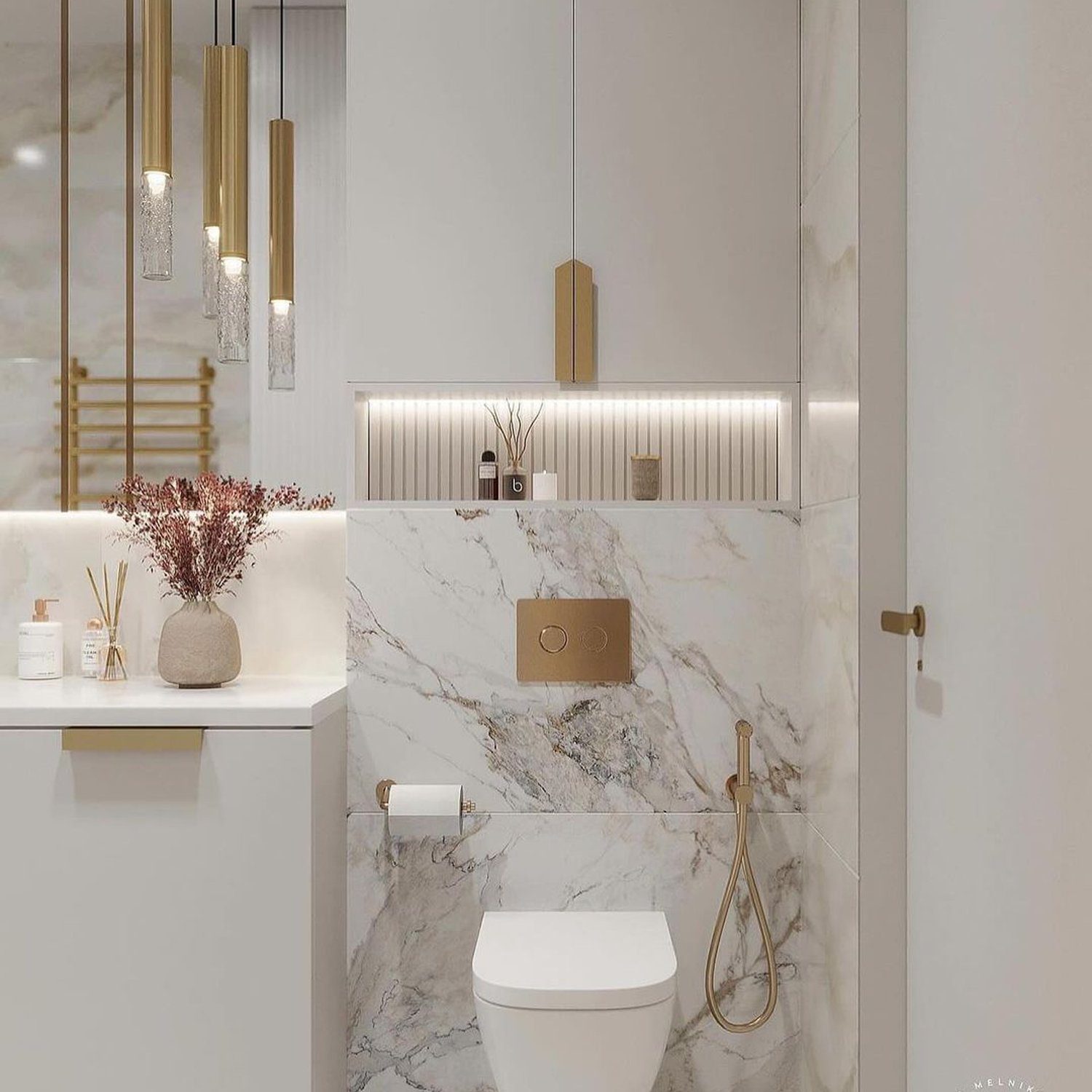 Elegant white and gold themed bathroom featuring marble tiles