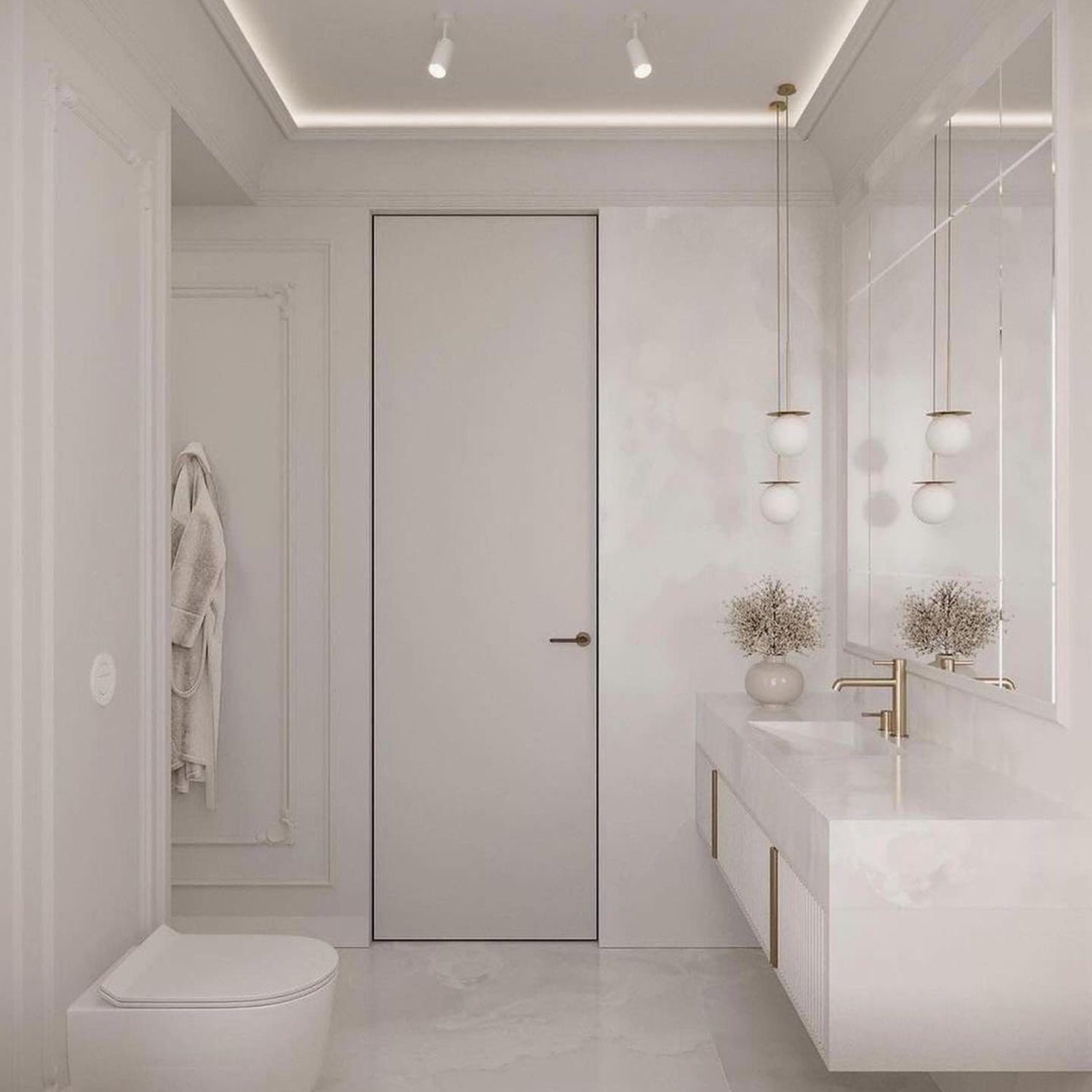 A modern white marble bathroom featuring minimalist design