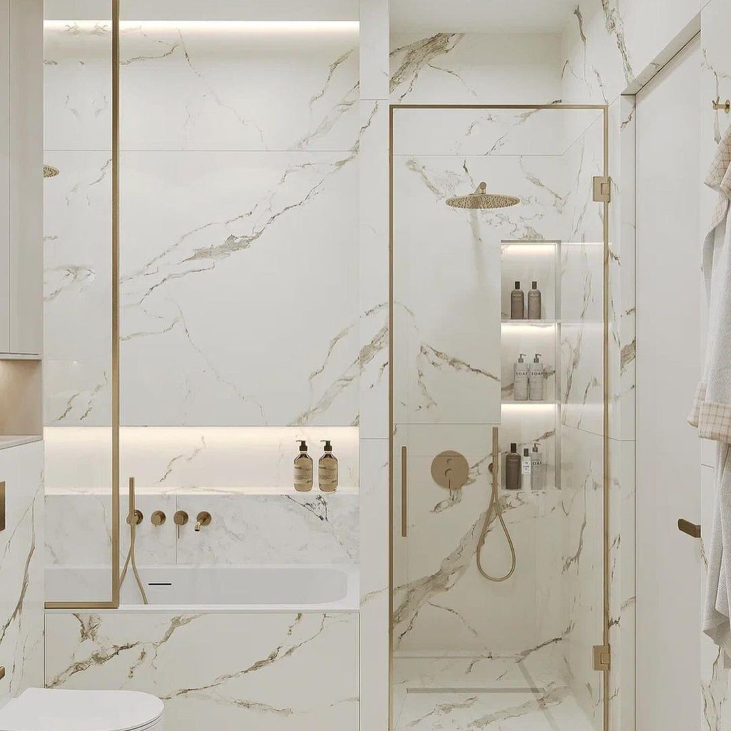 Elegant white marble bathroom with golden accents