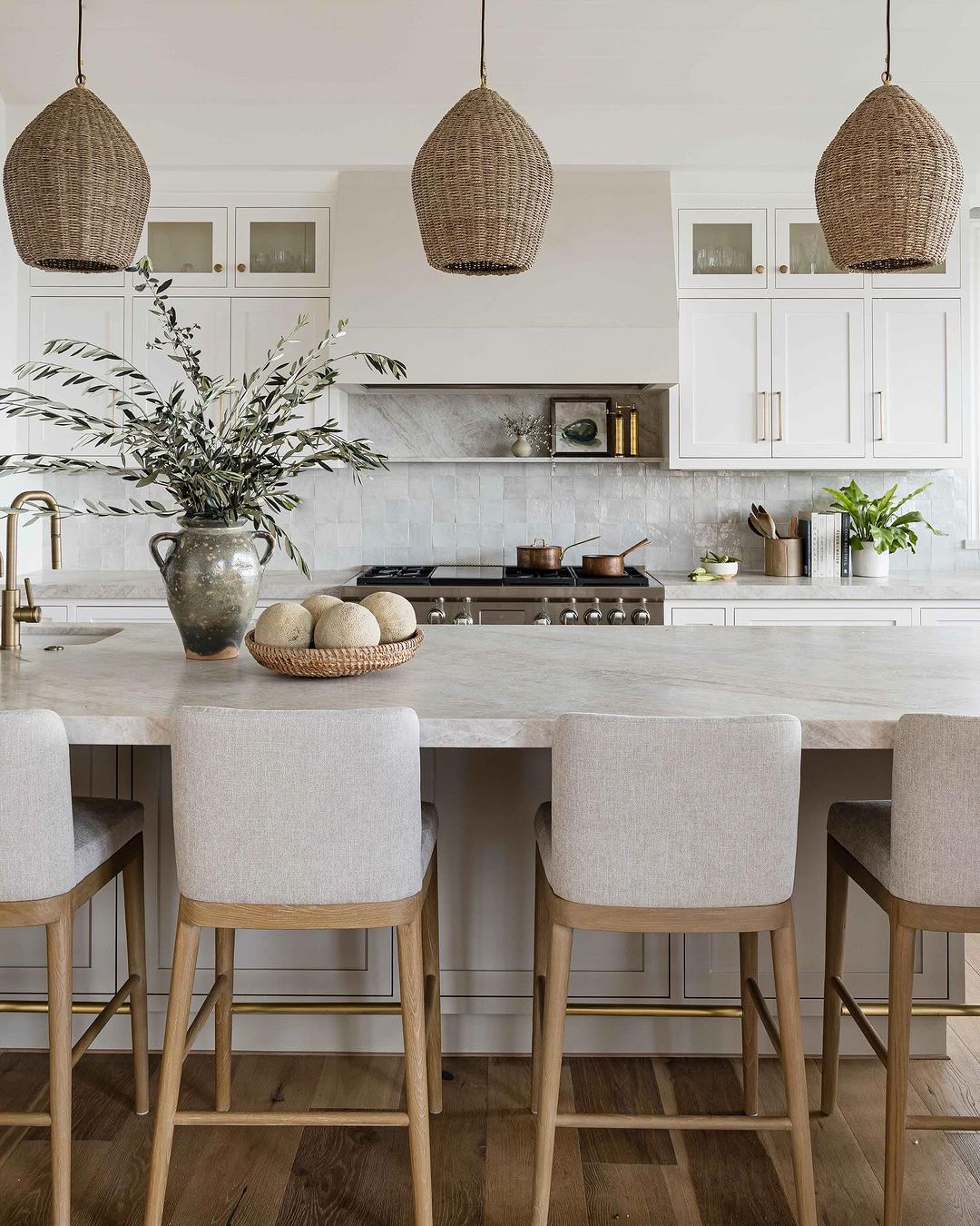 A serene kitchen with wicker pendant lighting